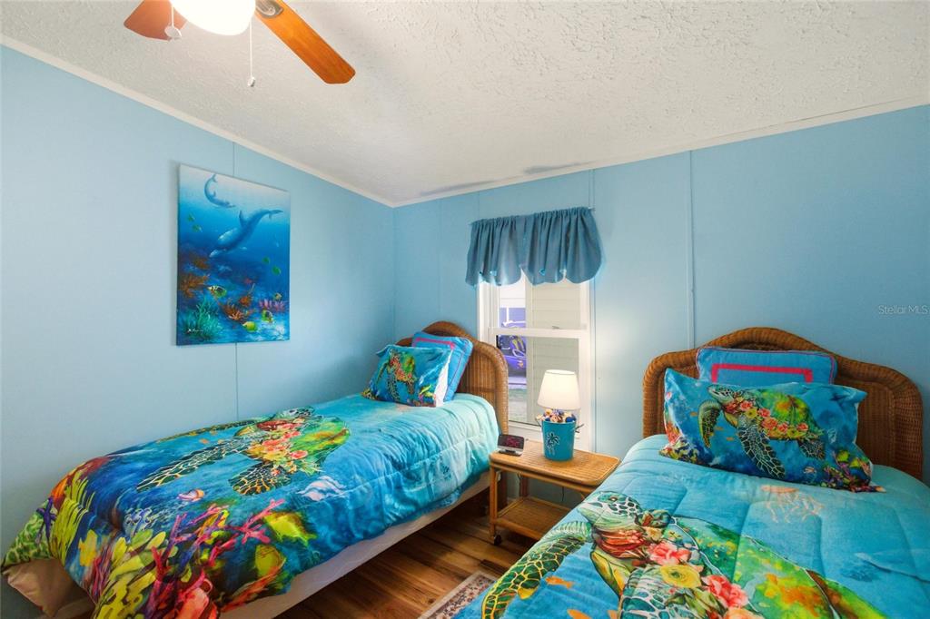 15 North Cardinal, Unit B15 Punta Gorda, FL 33950 - Photo 23 of 49 a bedroom with two beds and a small place