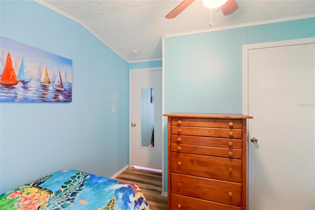 15 North Cardinal, Unit B15 Punta Gorda, FL 33950 - Photo 25 of 49 a room with a bed and a dresser