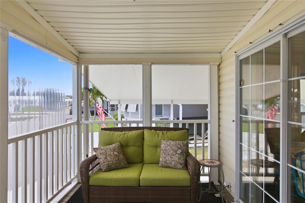 15 North Cardinal, Unit B15 Punta Gorda, FL 33950 - Photo 29 of 49 a balcony with furniture and a potted plant