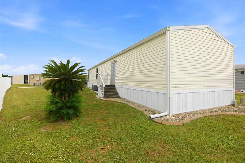 15 North Cardinal, Unit B15 Punta Gorda, FL 33950 - Photo 33 of 49 a view of a white house with a yard