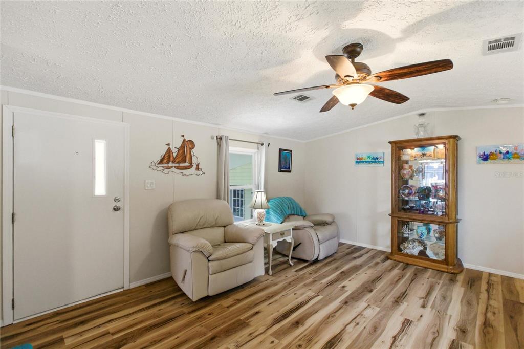 15 North Cardinal, Unit B15 Punta Gorda, FL 33950 - Photo 6 of 49 a living room with furniture and a wooden floor