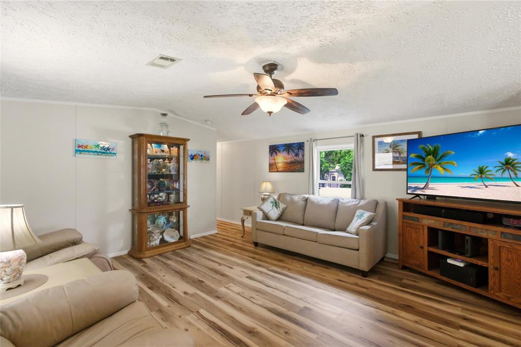 15 North Cardinal, Unit B15 Punta Gorda, FL 33950 - Photo 7 of 49 a living room with furniture and a fireplace