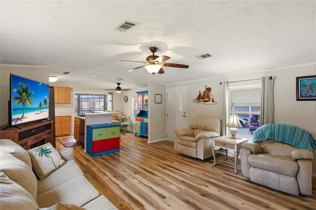 15 North Cardinal, Unit B15 Punta Gorda, FL 33950 - Photo 9 of 49 a living room with furniture and a flat screen tv