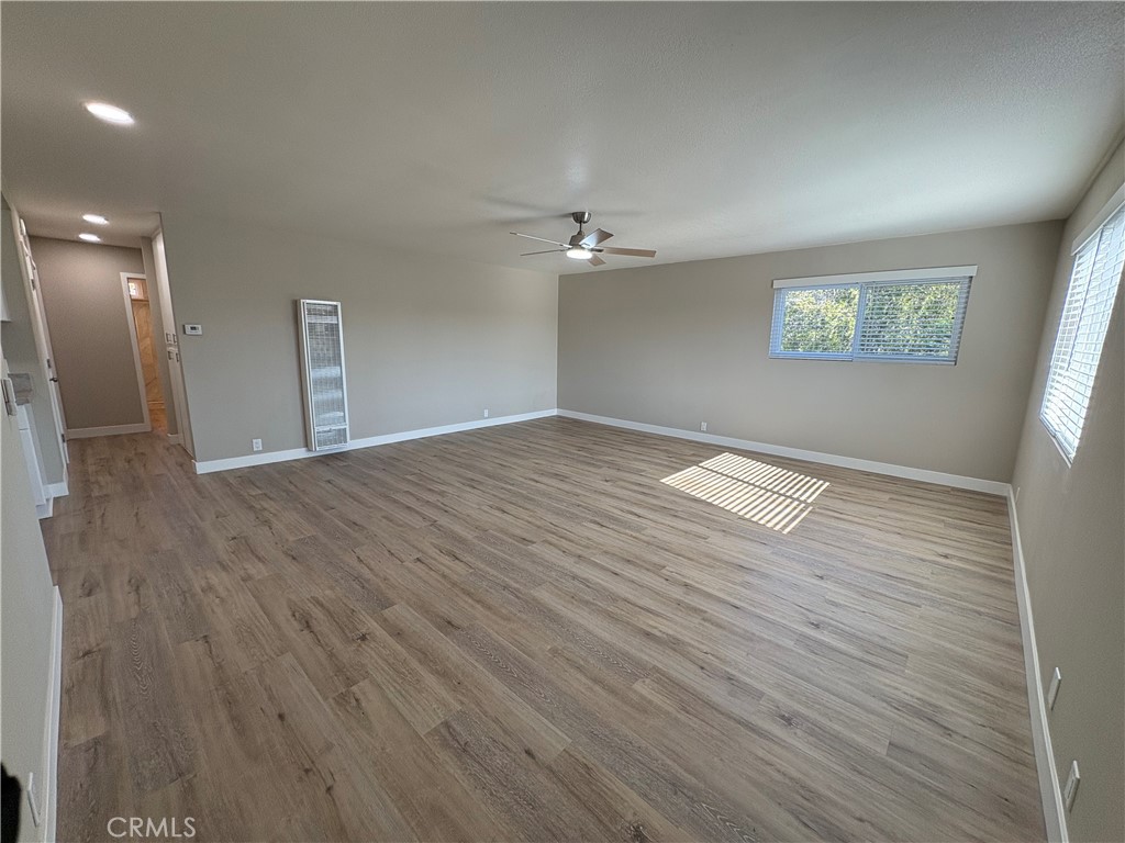 33972 El Encanto Avenue, Unit D Dana Point, CA 92629 - Photo 12 of 46 wooden floor in an empty room with a window