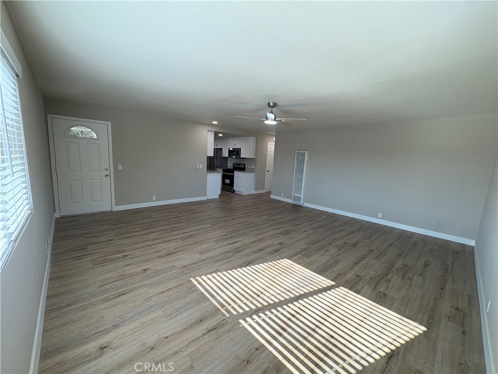 33972 El Encanto Avenue, Unit D Dana Point, CA 92629 - Photo 13 of 46 wooden floor in an empty room with a window