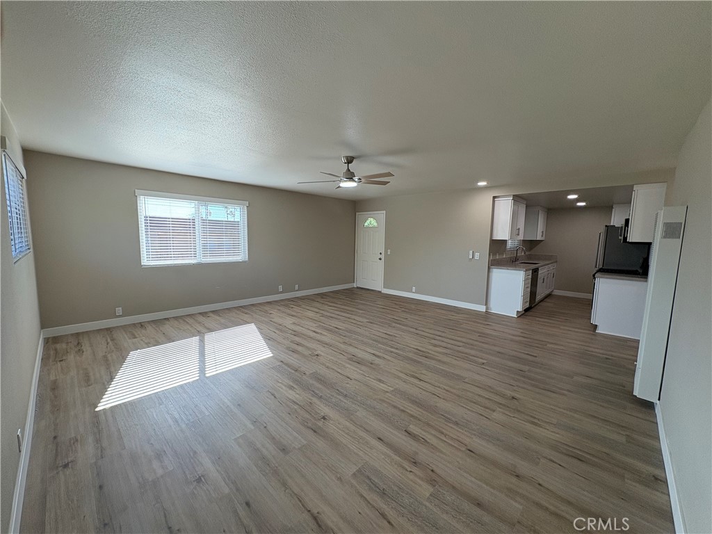 33972 El Encanto Avenue, Unit D Dana Point, CA 92629 - Photo 14 of 46 wooden floor in an empty room with a window