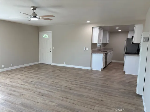 a view of a kitchen with a sink and a stove