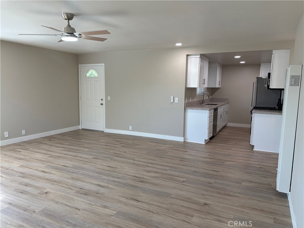 33972 El Encanto Avenue, Unit D Dana Point, CA 92629 - Photo 15 of 46 a view of a kitchen with a sink and a stove