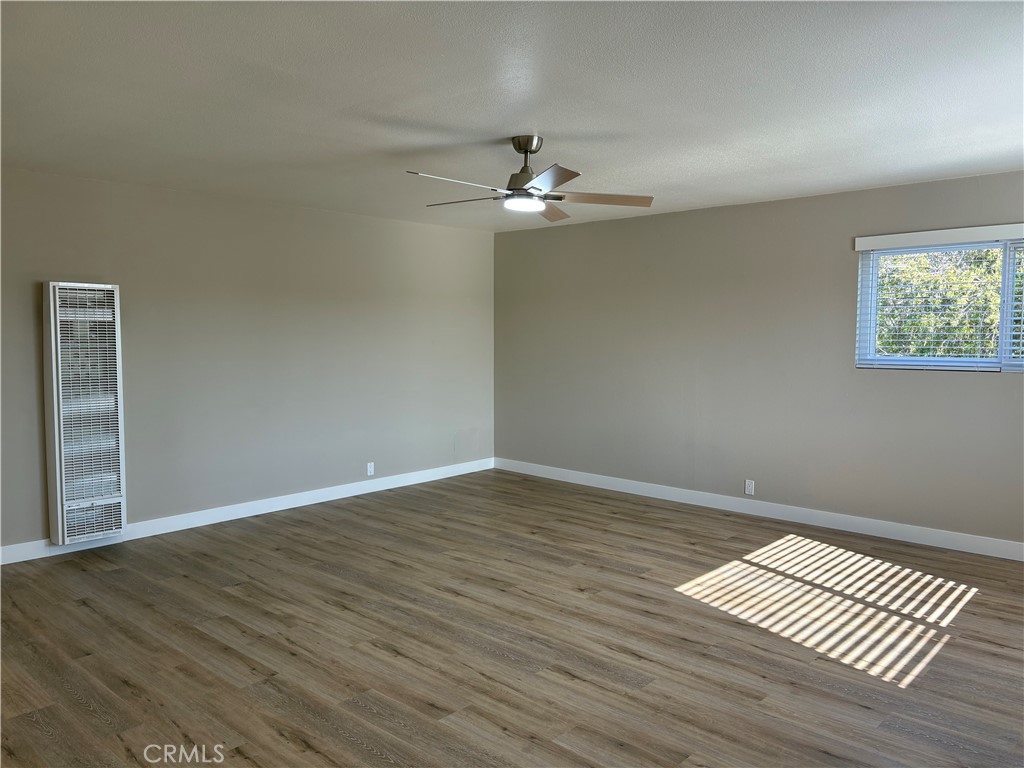 33972 El Encanto Avenue, Unit D Dana Point, CA 92629 - Photo 18 of 46 a view of empty room with wooden floor
