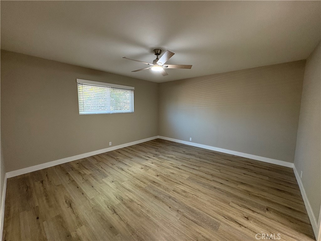 33972 El Encanto Avenue, Unit D Dana Point, CA 92629 - Photo 20 of 46 wooden floor in an empty room with a window