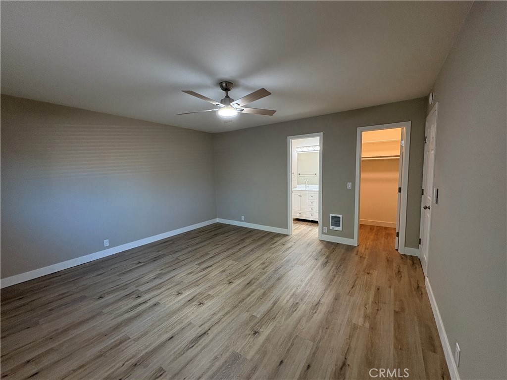 33972 El Encanto Avenue, Unit D Dana Point, CA 92629 - Photo 21 of 46 wooden floor in an empty room with a window