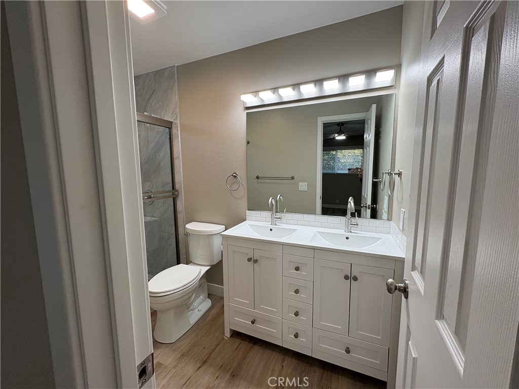 33972 El Encanto Avenue, Unit D Dana Point, CA 92629 - Photo 23 of 46 a view of bathroom with a toilet sink and mirror