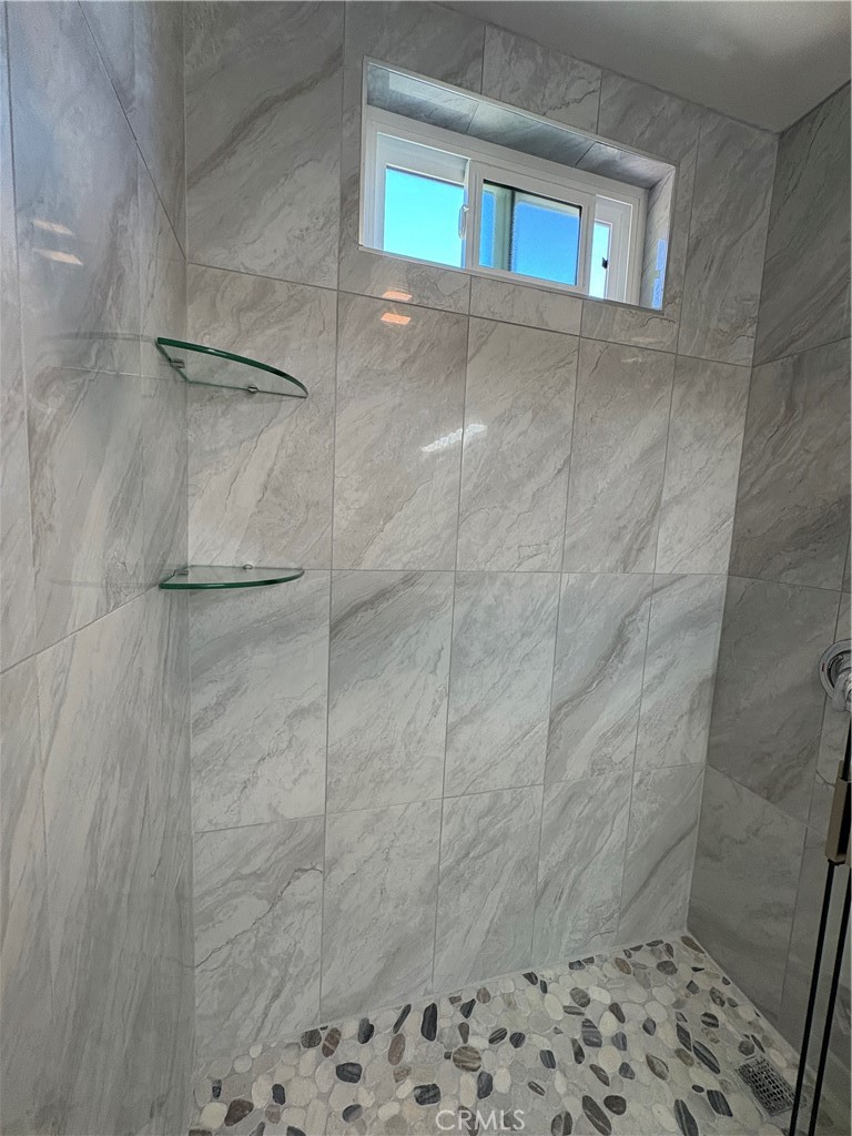 33972 El Encanto Avenue, Unit D Dana Point, CA 92629 - Photo 24 of 46 a bathroom with a shower