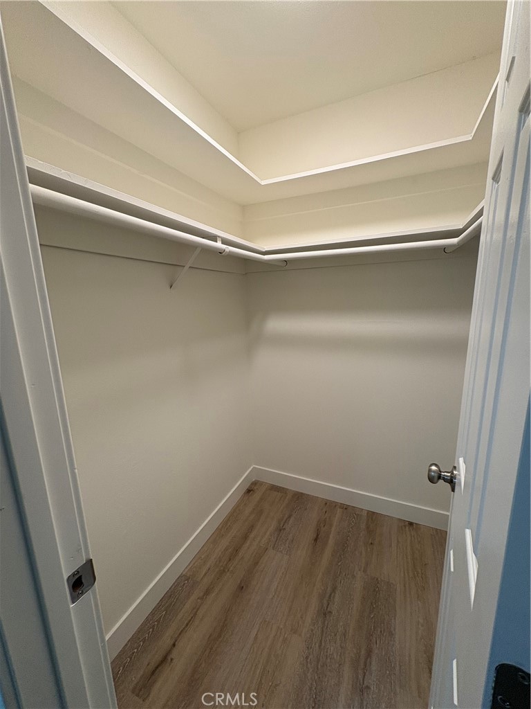 33972 El Encanto Avenue, Unit D Dana Point, CA 92629 - Photo 27 of 46 a view of a room with wooden floor