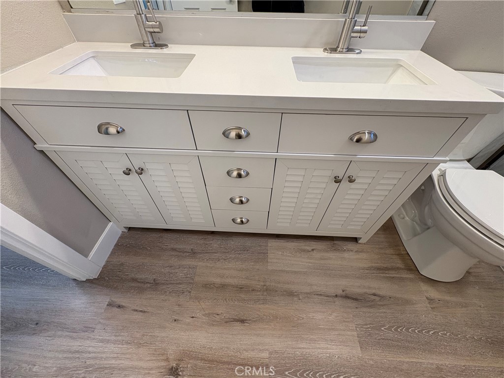 33972 El Encanto Avenue, Unit D Dana Point, CA 92629 - Photo 38 of 46 a bathroom with a sink and a mirror