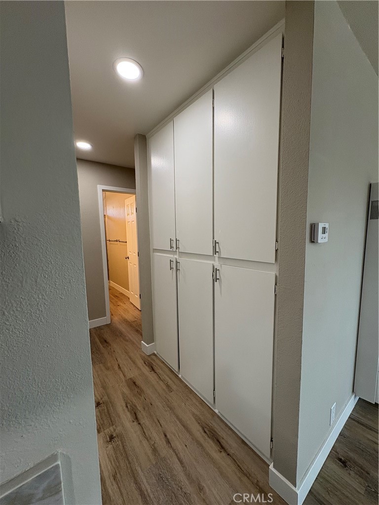 33972 El Encanto Avenue, Unit D Dana Point, CA 92629 - Photo 39 of 46 a view of hallway with wooden floor