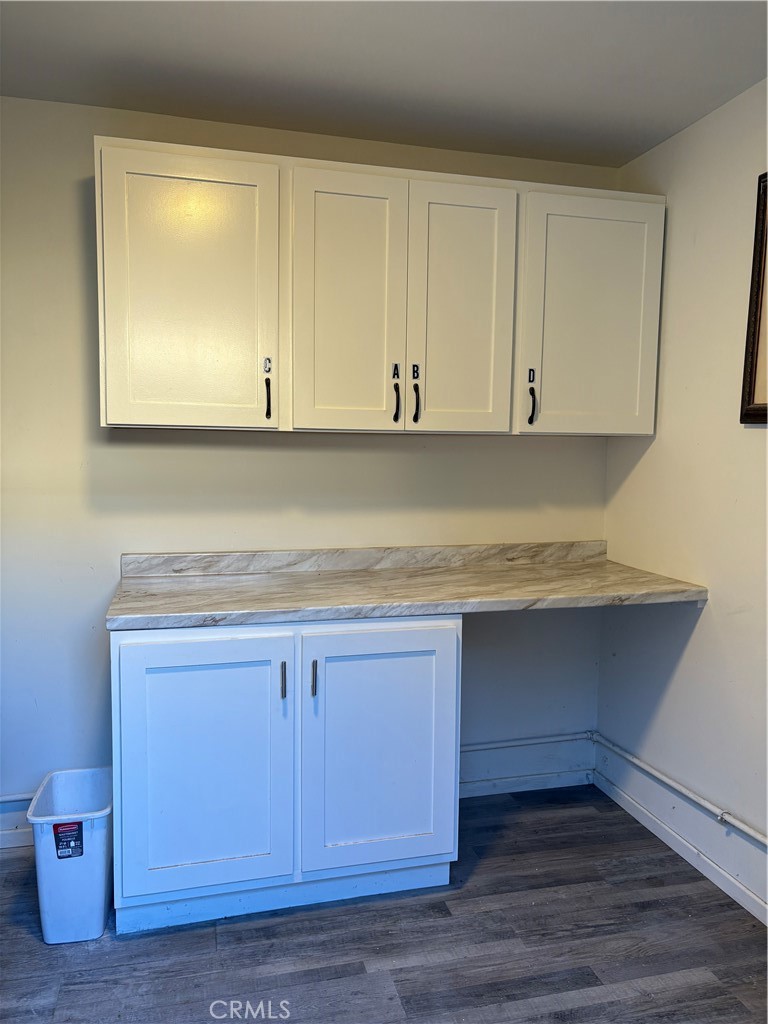 33972 El Encanto Avenue, Unit D Dana Point, CA 92629 - Photo 42 of 46 a view of cabinets and wooden floor