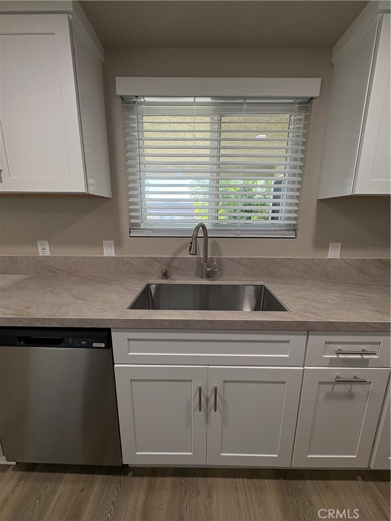 33972 El Encanto Avenue, Unit D Dana Point, CA 92629 - Photo 9 of 46 a kitchen with a sink and cabinets