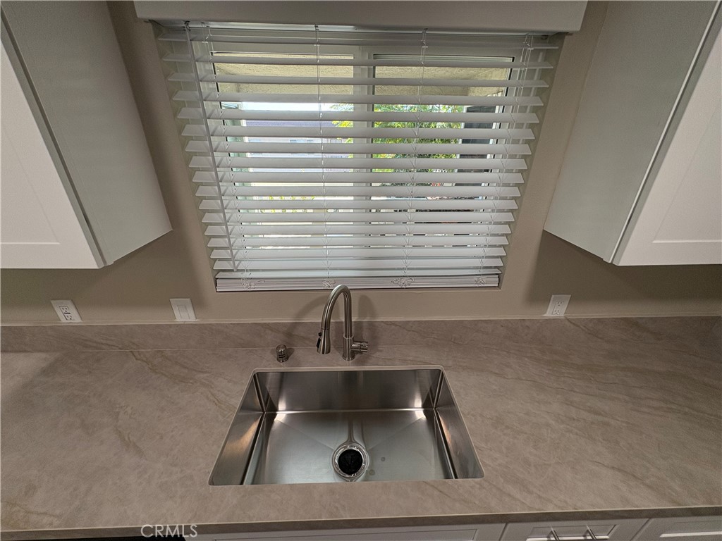 33972 El Encanto Avenue, Unit D Dana Point, CA 92629 - Photo 10 of 46 a bathroom with a sink a vanity and a window