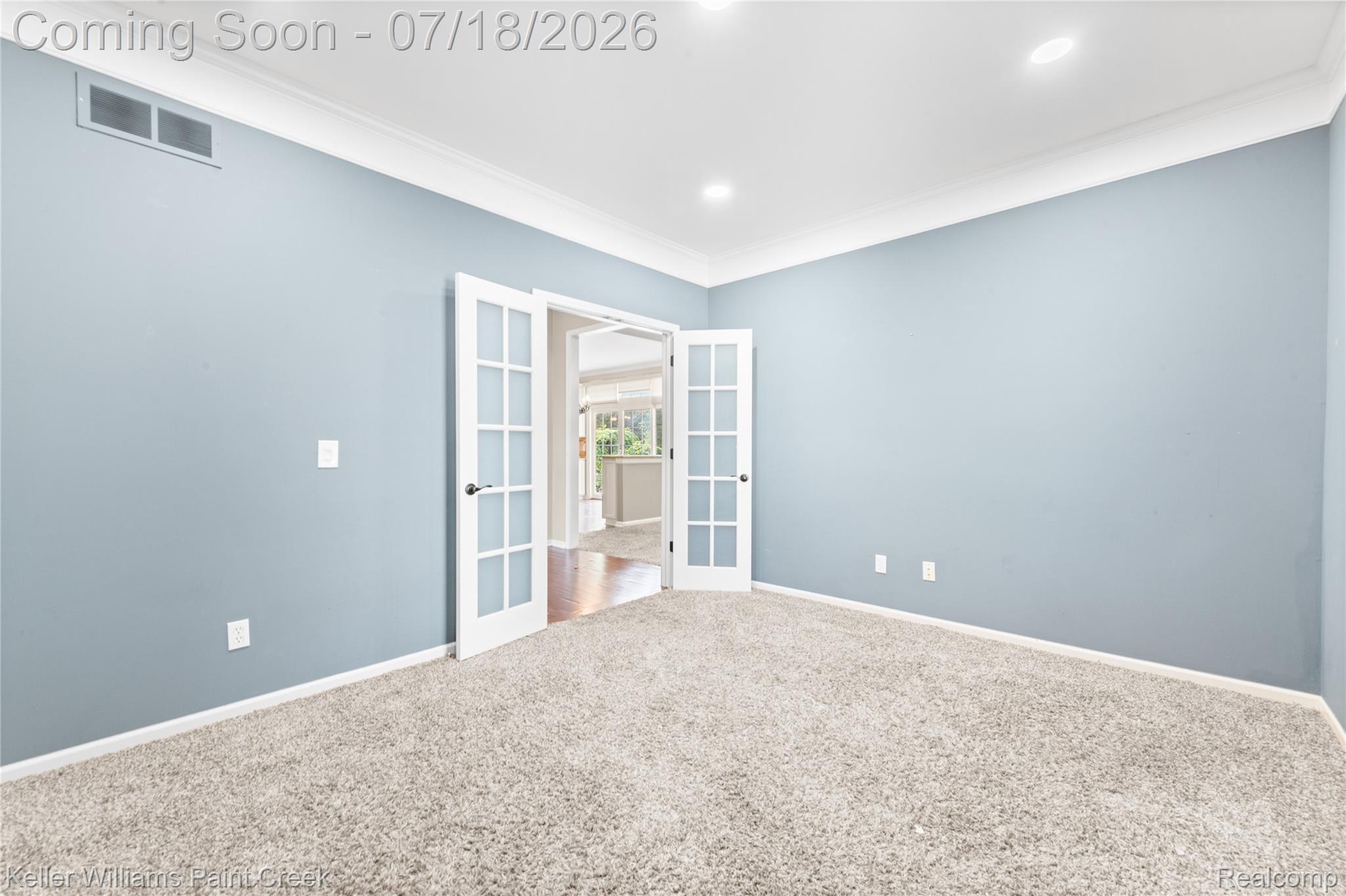 4230 Holly Lane Rochester, MI 48306 - Photo 22 of 64 Spacious room featuring light blue walls and plush grey carpeting