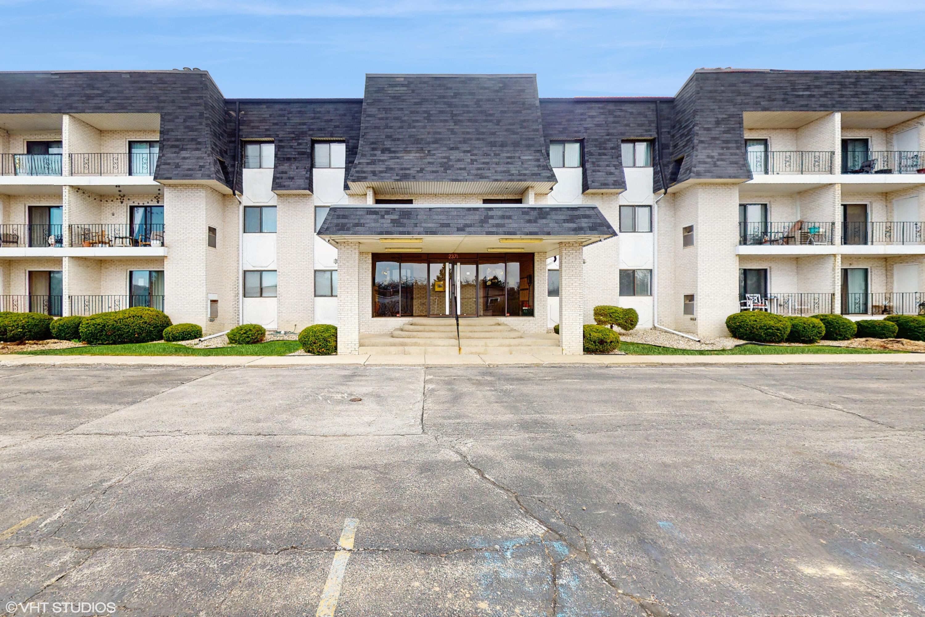 2371 Deerpath Drive, Unit 101 Schererville, IN 46375 - Photo 1 of 13 a view of multiple building