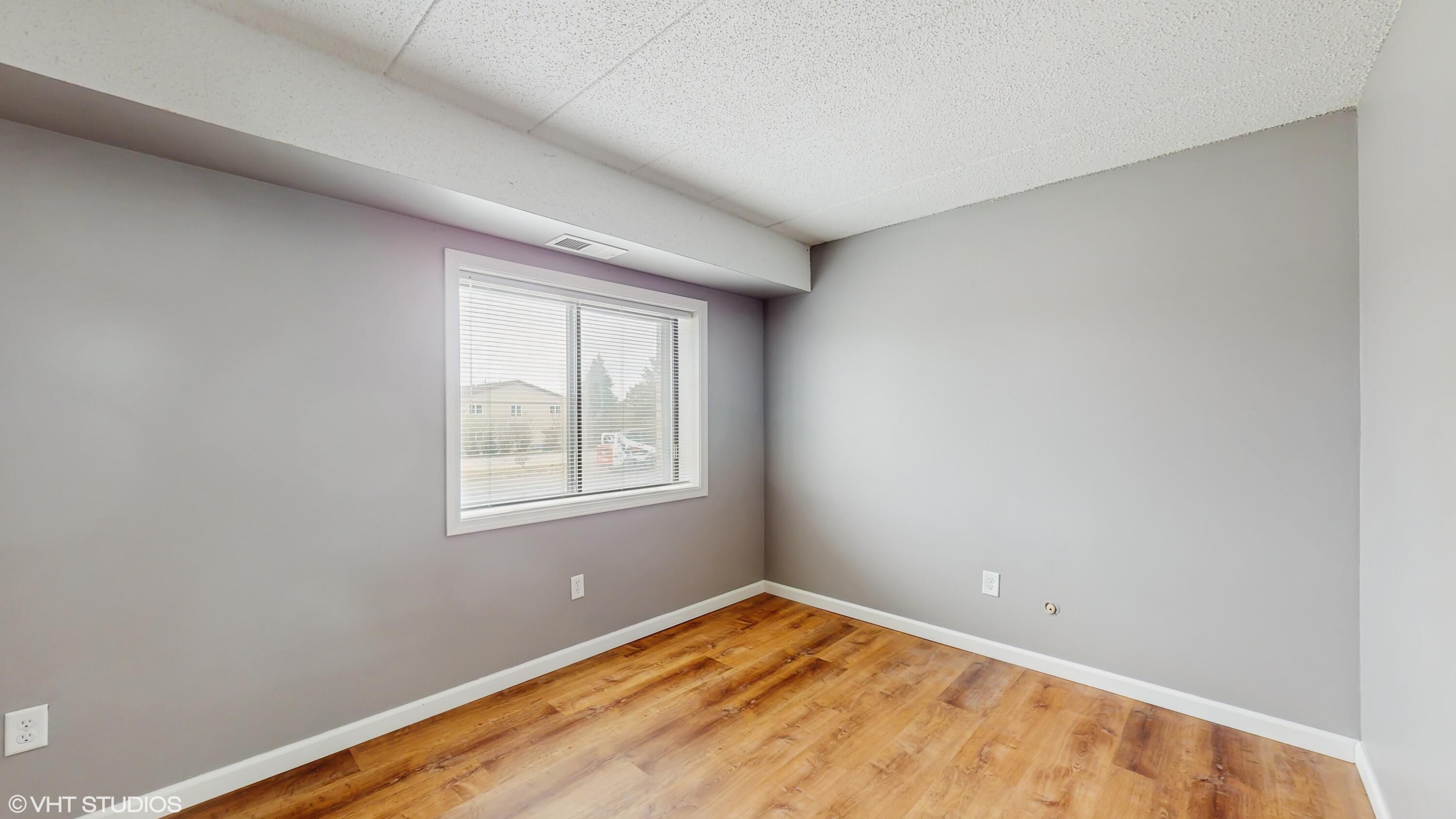2371 Deerpath Drive, Unit 101 Schererville, IN 46375 - Photo 11 of 13 an empty room with a window