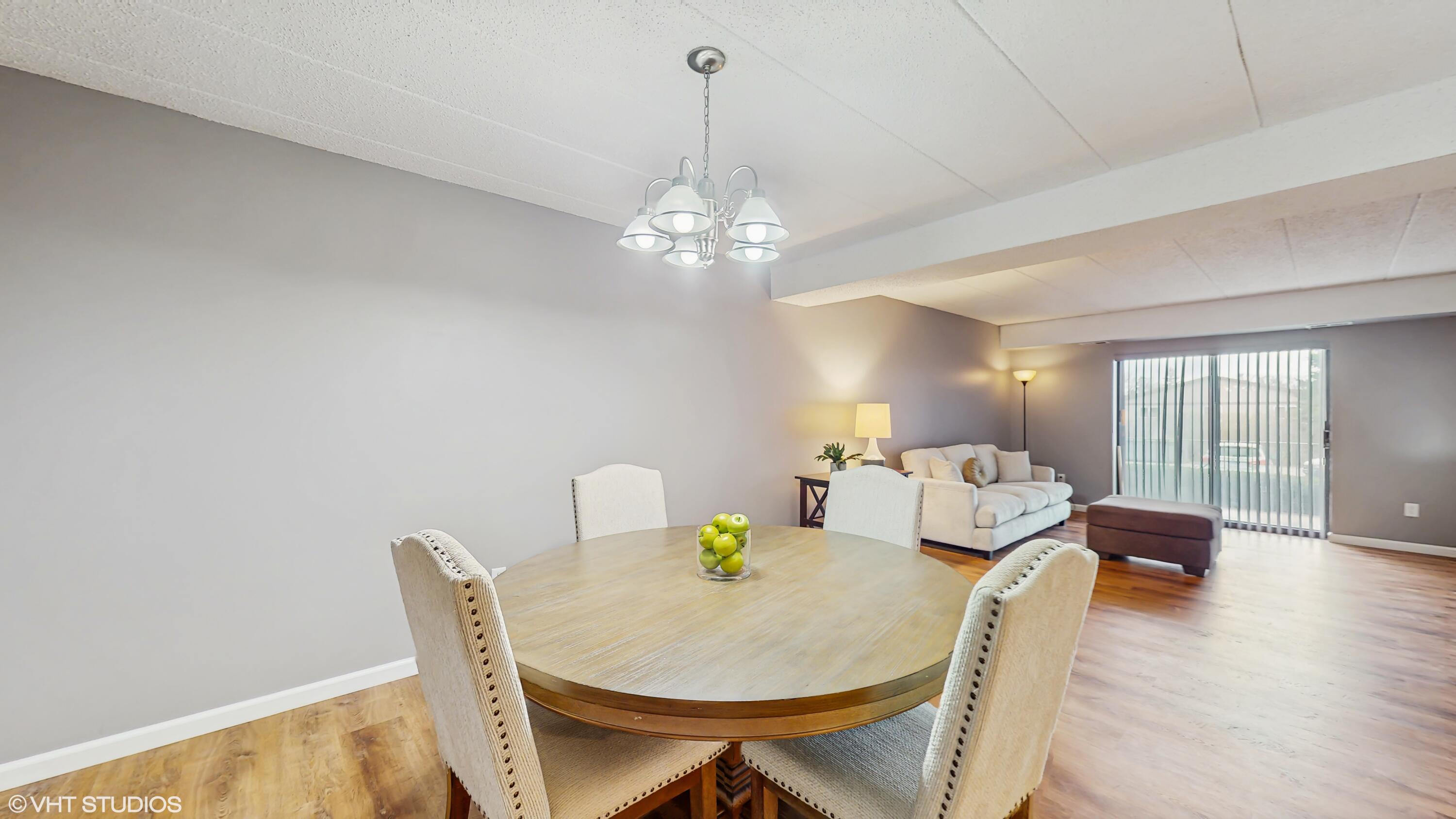 2371 Deerpath Drive, Unit 101 Schererville, IN 46375 - Photo 3 of 13 a view of a dining room with furniture and wooden floor