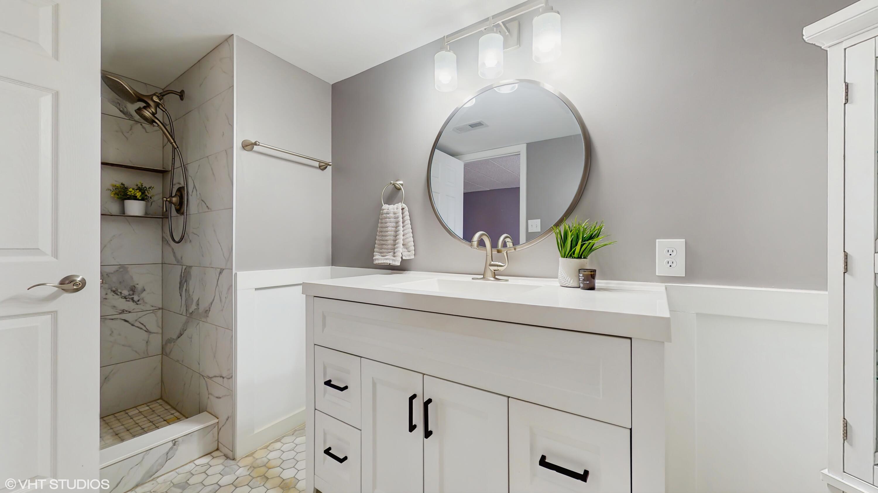 2371 Deerpath Drive, Unit 101 Schererville, IN 46375 - Photo 8 of 13 a bathroom with a sink and a mirror