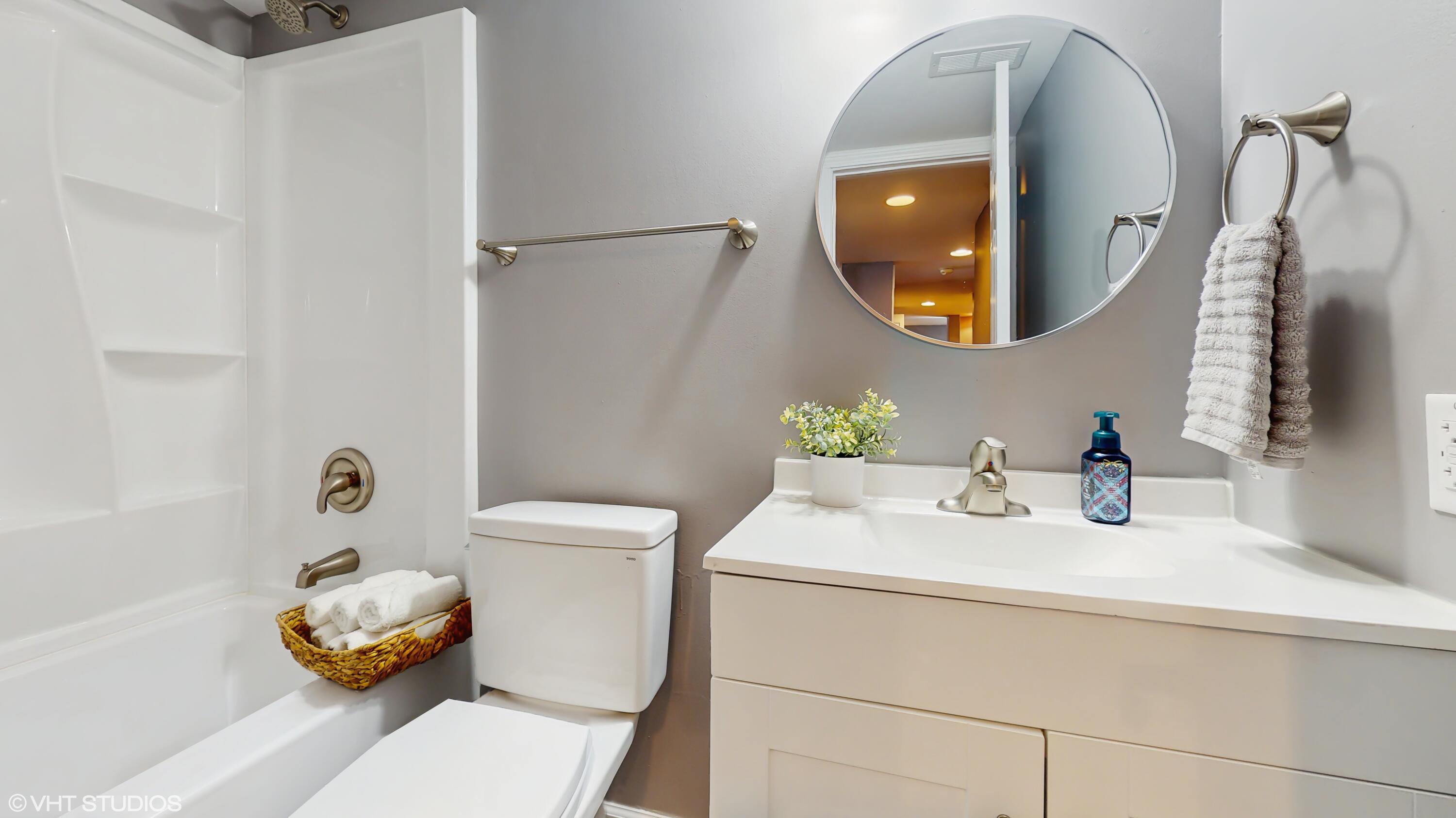 2371 Deerpath Drive, Unit 101 Schererville, IN 46375 - Photo 10 of 13 a bathroom with a sink toilet and mirror