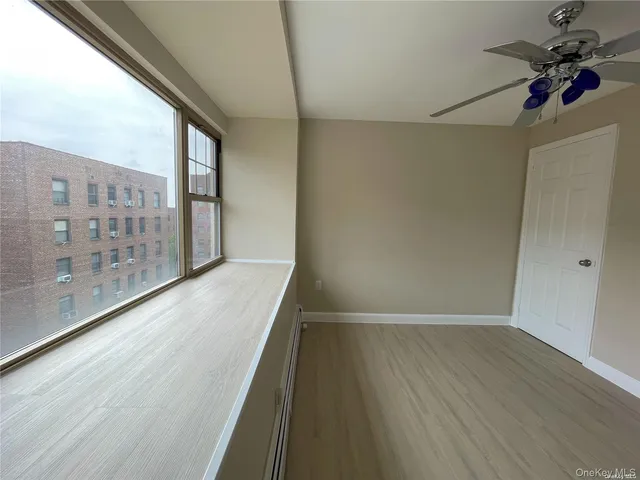 a kitchen with a sink and large mirror