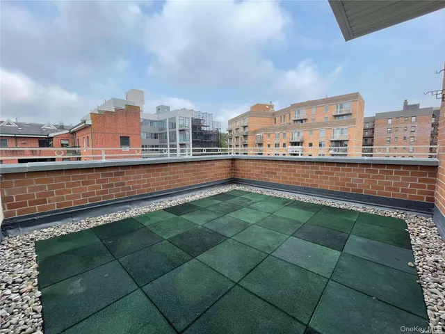 a view of kitchen and hall with wooden floor