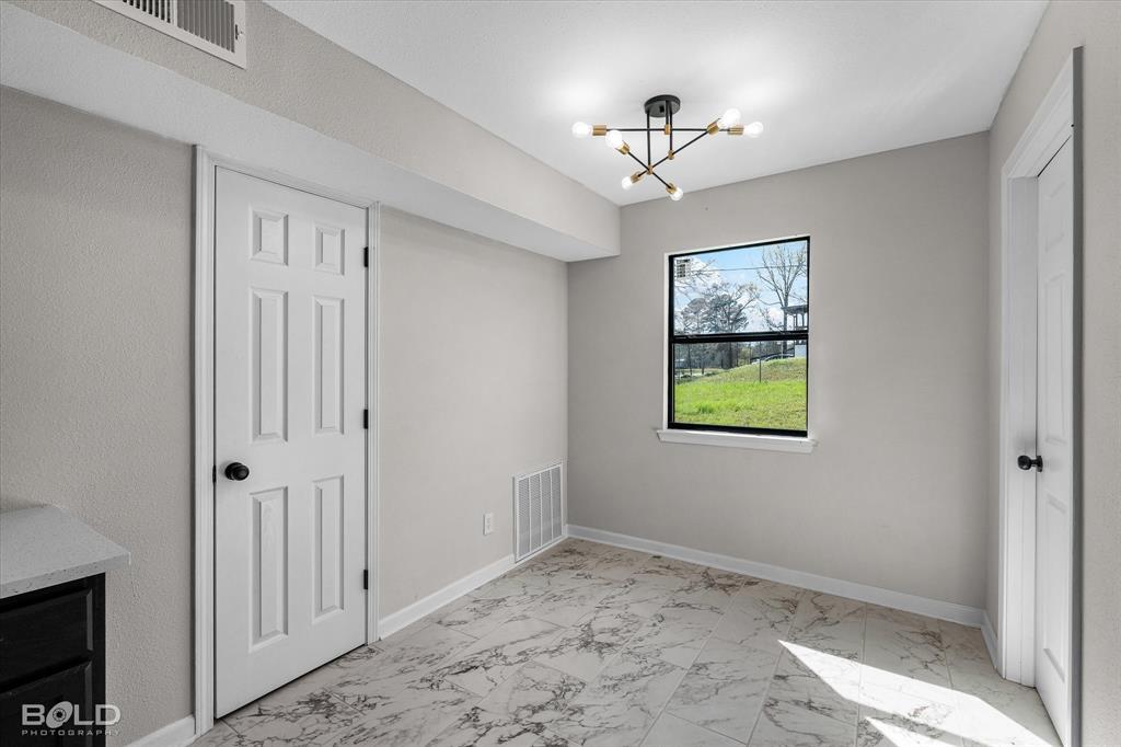 227 White Road Frierson, LA 71027 - Photo 16 of 37 Eat in Kitcen with laundry to the right and storage closet to the left