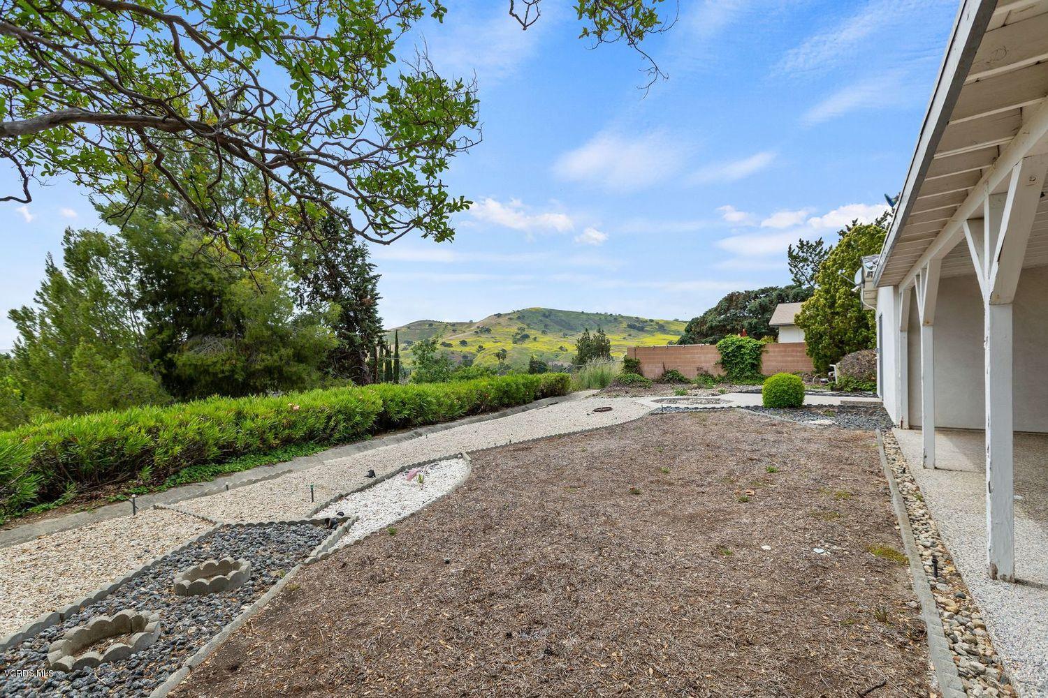 26003 Adamor Road Calabasas, CA 91302 - Photo 11 of 16 a view of a road with a building in the background