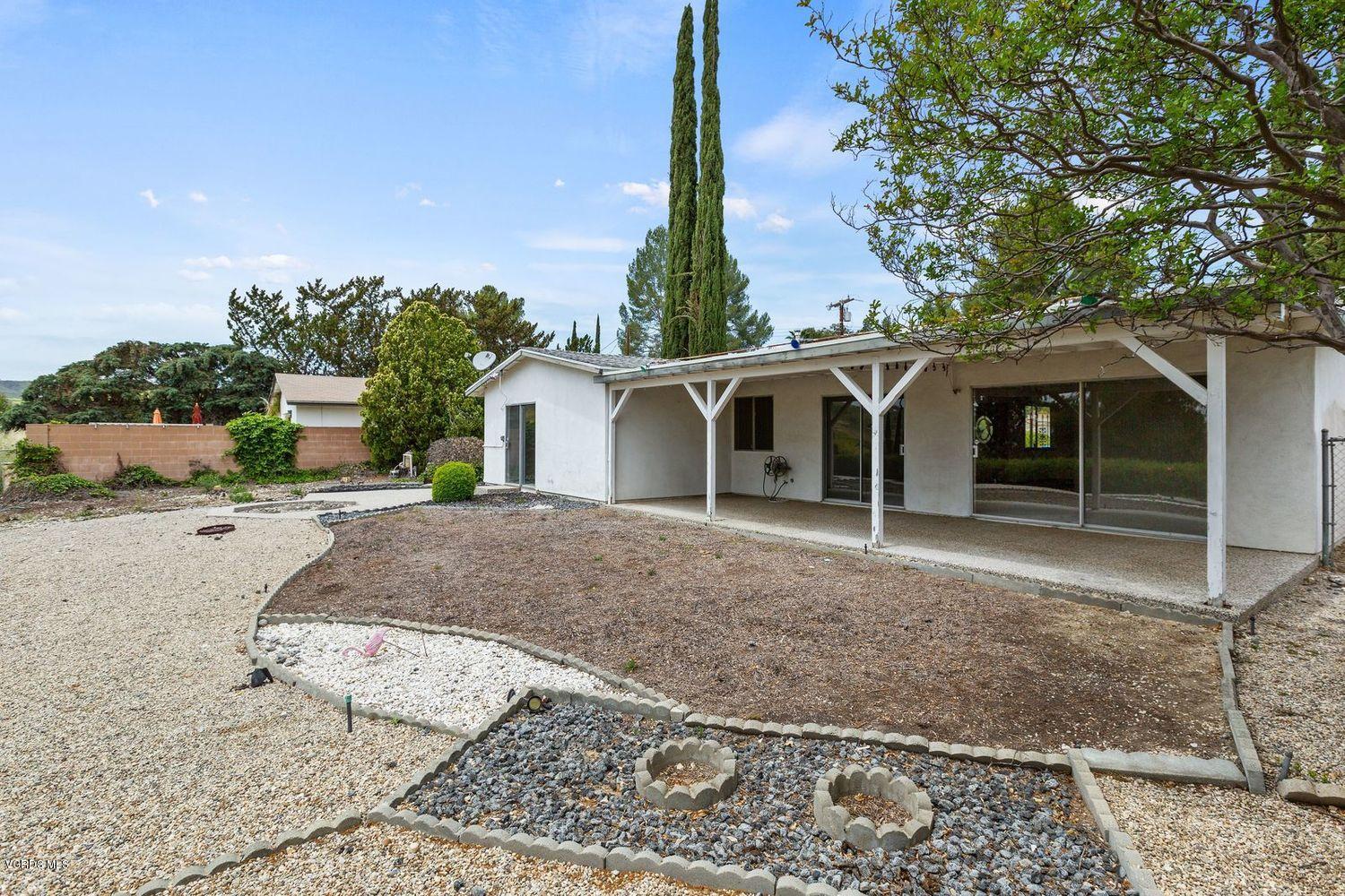 26003 Adamor Road Calabasas, CA 91302 - Photo 12 of 16 a view of a house with a yard and large tree