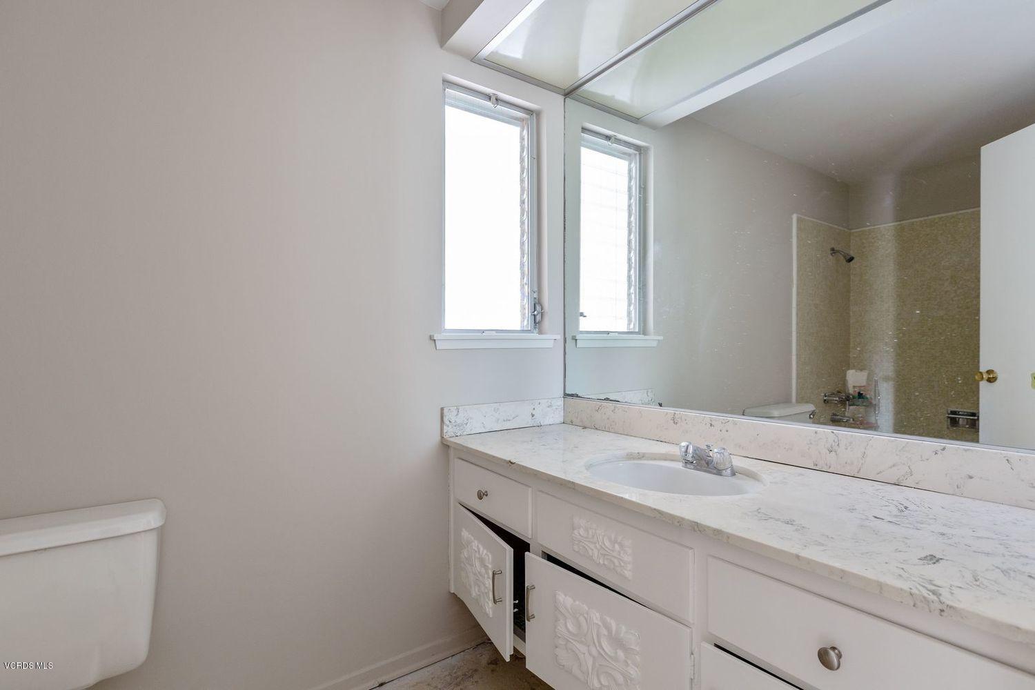 26003 Adamor Road Calabasas, CA 91302 - Photo 10 of 16 a bathroom with a sink and a mirror