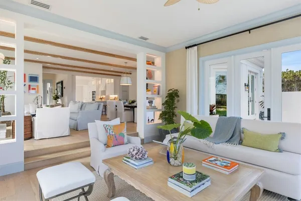 a dining room with furniture and wooden floor
