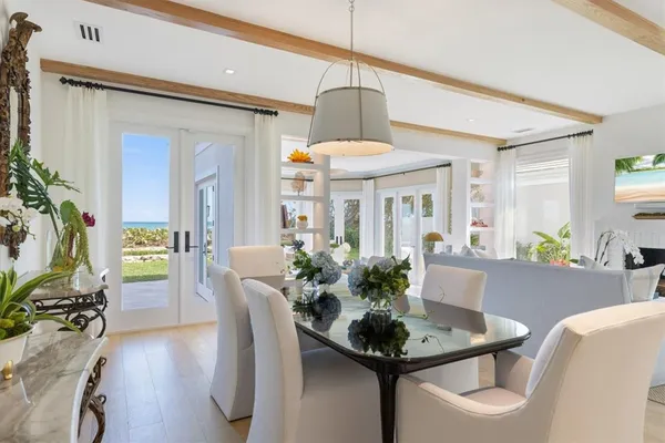 a large white kitchen with granite countertop lots of counter top space