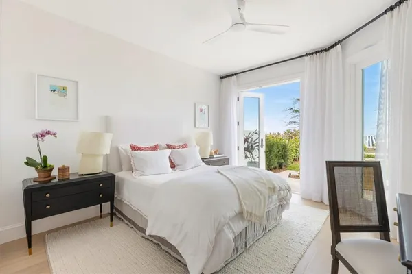 a bedroom with a bed and a table