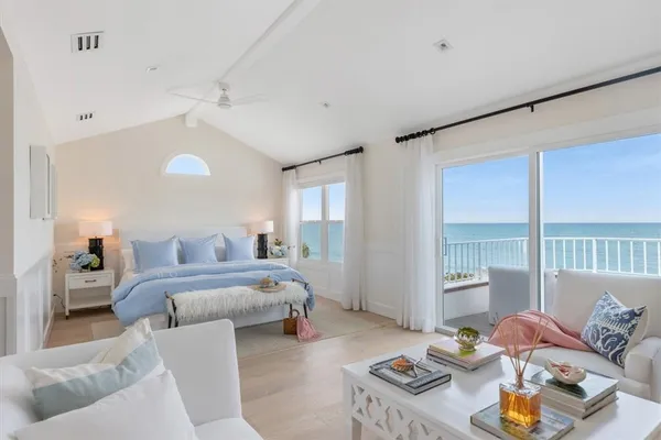 a bedroom with furniture and a window