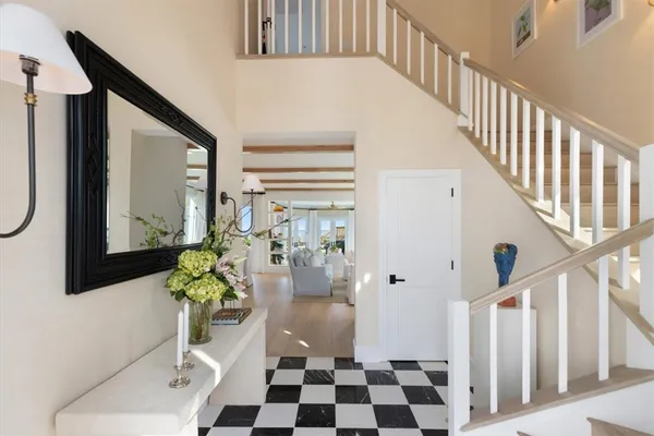 a view of entryway with wooden floor and a rug