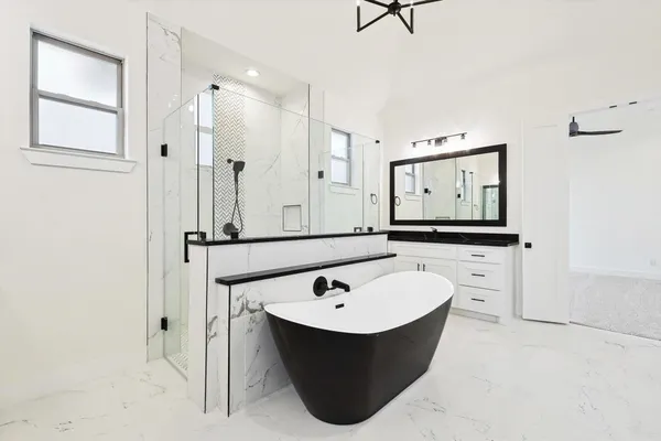 a bathroom with a bathtub and a sink