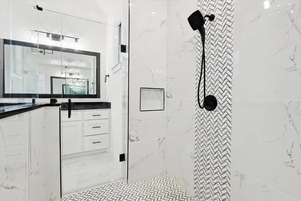 a bathroom with a bathtub and a shower