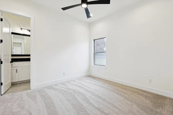 a view of a room with a empty space and wooden floor