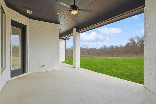 a view of a porch with a big yard