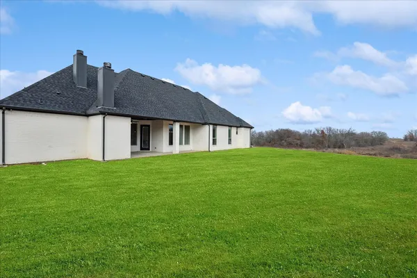 a house view with garden space