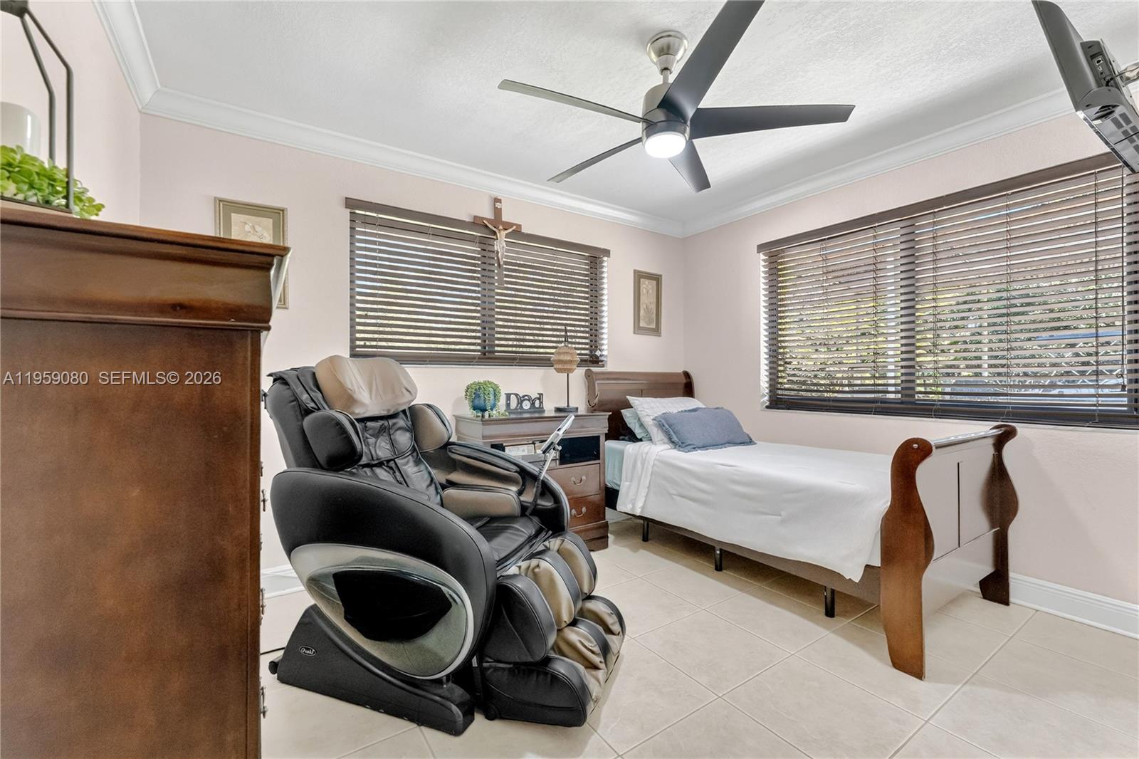 19225 Southwest 186th Street Miami, FL 33187 - Photo 16 of 42 a bedroom with furniture and a window