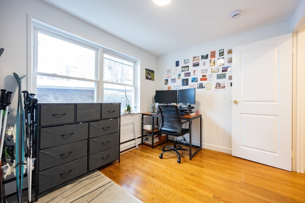 8 Avon Street, Unit 10 Somerville, MA 02143 - Photo 12 of 18 a view of a workspace with furniture and a window