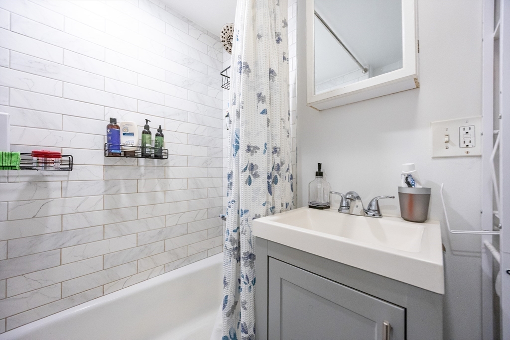 8 Avon Street, Unit 10 Somerville, MA 02143 - Photo 15 of 18 a bathroom with a sink and a bathtub