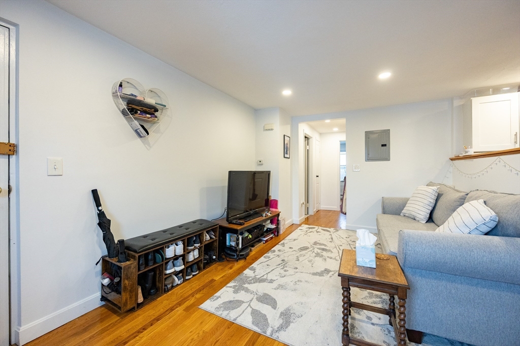 8 Avon Street, Unit 10 Somerville, MA 02143 - Photo 3 of 18 a living room with furniture and a flat screen tv