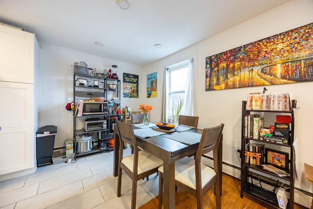 8 Avon Street, Unit 10 Somerville, MA 02143 - Photo 5 of 18 a view of a workspace with furniture and toys